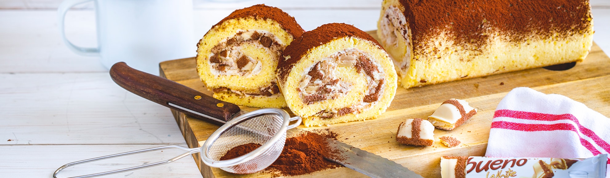 Biskuitrolle mit Creme und kinder bueno White - kinder Deutschland