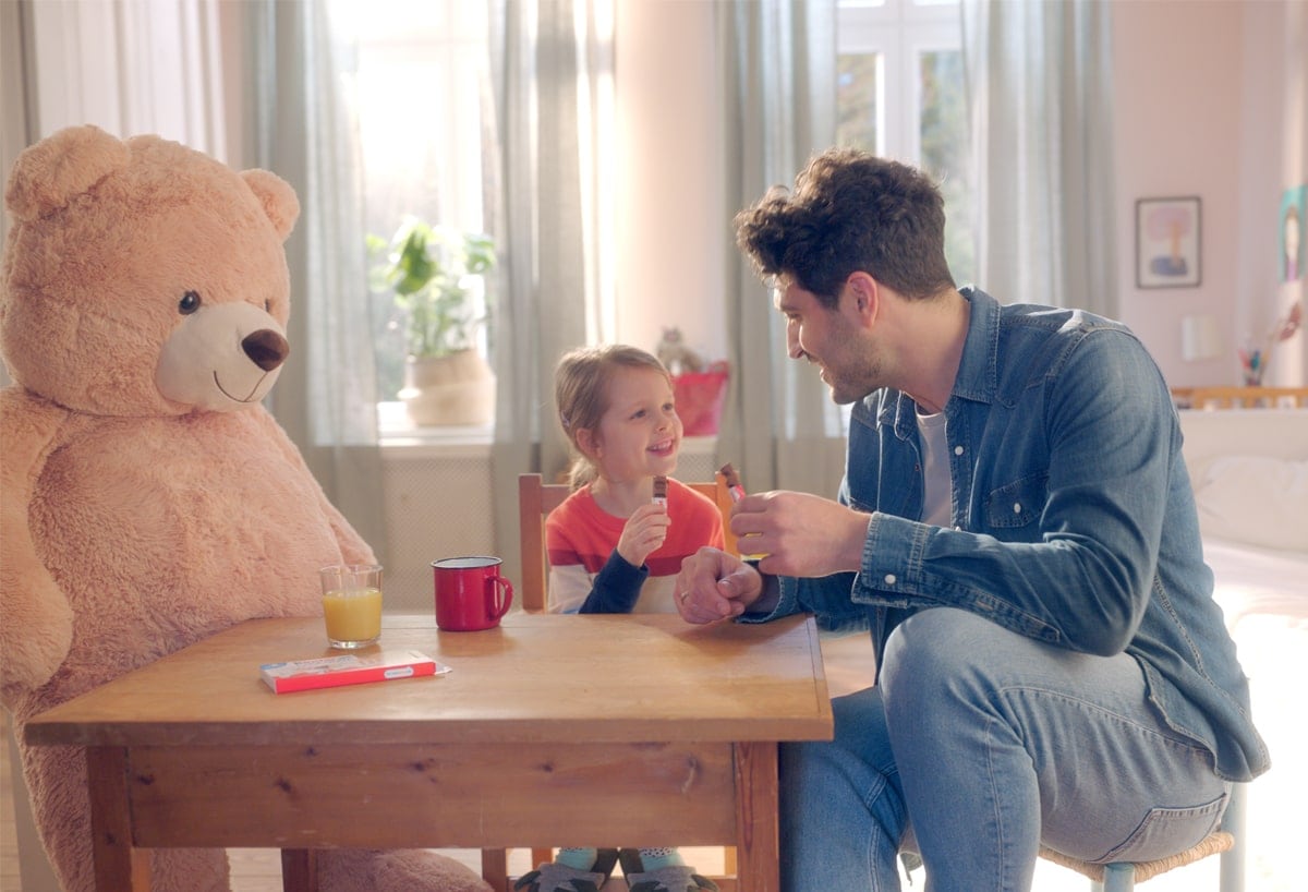 Father and Son eating Kinder